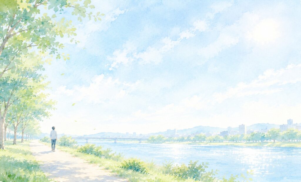 川沿いの道を歩きながら空を見上げる人